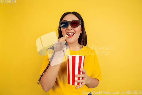 Image of Caucasian woman\'s portrait isolated on yellow studio background