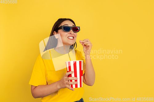 Image of Caucasian woman\'s portrait isolated on yellow studio background