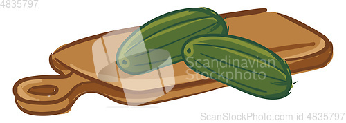 Image of Couple of cucumbers on a chopping board 