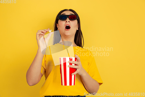 Image of Caucasian woman\'s portrait isolated on yellow studio background