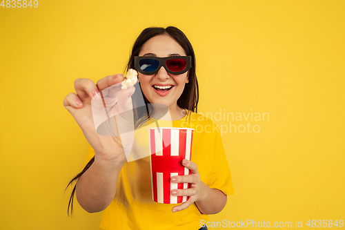 Image of Caucasian woman\'s portrait isolated on yellow studio background