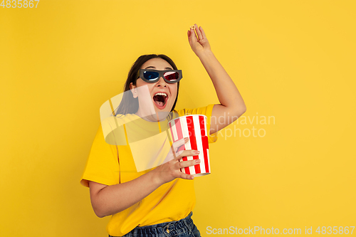 Image of Caucasian woman\'s portrait isolated on yellow studio background