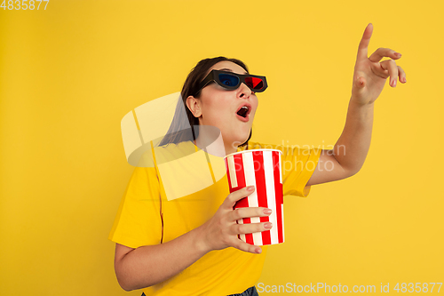 Image of Caucasian woman\'s portrait isolated on yellow studio background
