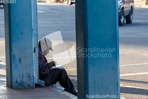 Image of Man resting on street in Bulawayo City, Zimbabwe