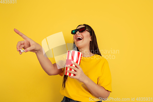 Image of Caucasian woman\'s portrait isolated on yellow studio background