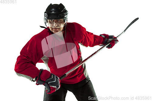 Image of Male hockey player with the stick on ice court and white background