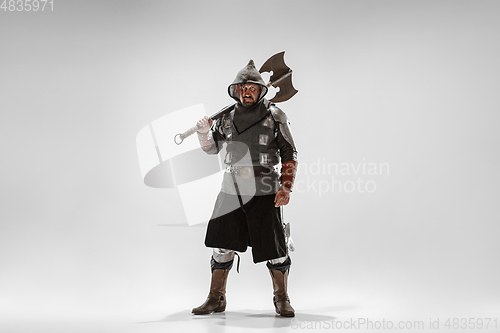 Image of Brave armored knight fighting isolated on white studio background