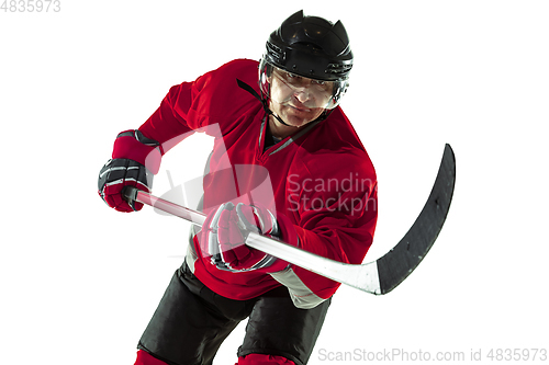 Image of Male hockey player with the stick on ice court and white background