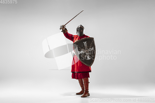 Image of Brave armored knight fighting isolated on white studio background