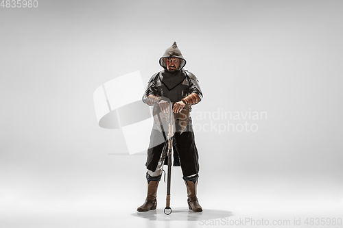 Image of Brave armored knight fighting isolated on white studio background