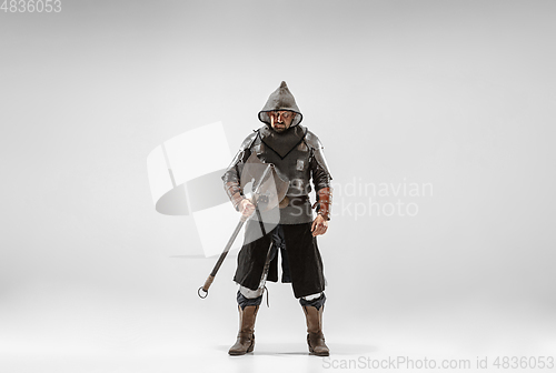 Image of Brave armored knight fighting isolated on white studio background