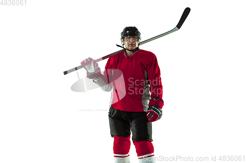 Image of Male hockey player with the stick on ice court and white background