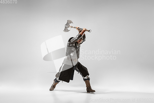 Image of Brave armored knight fighting isolated on white studio background