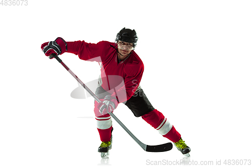 Image of Male hockey player with the stick on ice court and white background