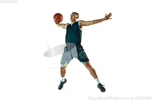 Image of Young basketball player training isolated on white studio background