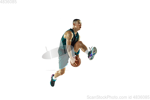 Image of Young basketball player training isolated on white studio background