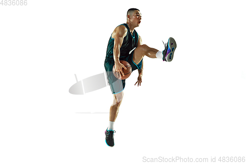 Image of Young basketball player training isolated on white studio background