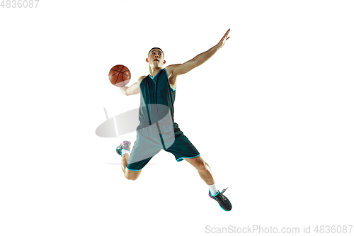 Image of Young basketball player training isolated on white studio background