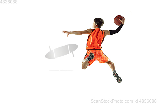 Image of Young basketball player training isolated on white studio background