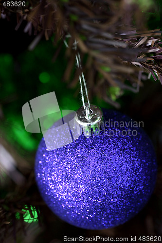 Image of Christmas ornaments on tree.