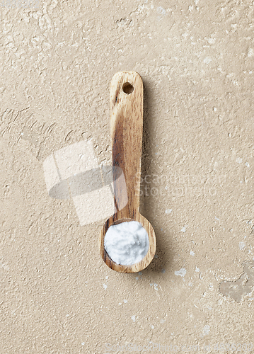 Image of baking soda in wooden spoon