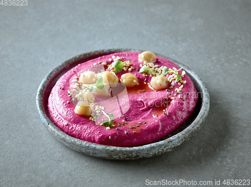 Image of plate of beetroot hummus