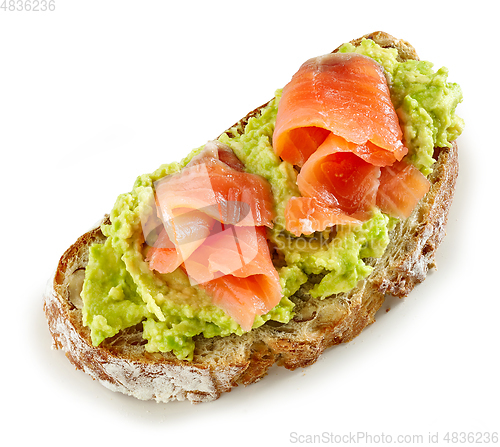 Image of slice of bread with avocado and salmon