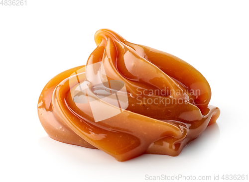Image of melted caramel on white background
