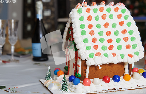 Image of Christmas Gingerbread house on the table in Christmas decorated