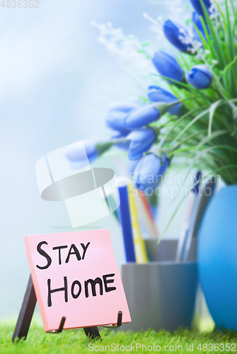 Image of Adhesive note with Stay Home text at the green office