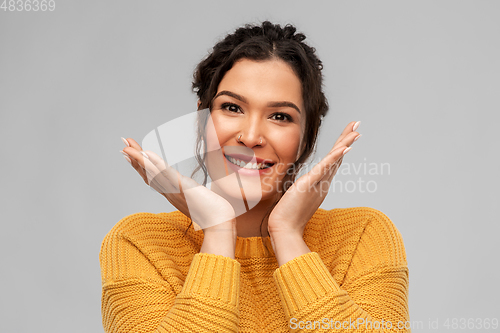 Image of happy smiling young woman with pierced nose