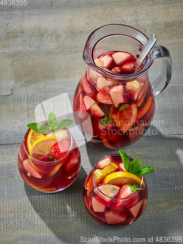 Image of red sangria on wooden table