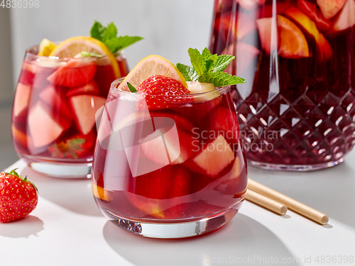 Image of close up of red sangria glasses