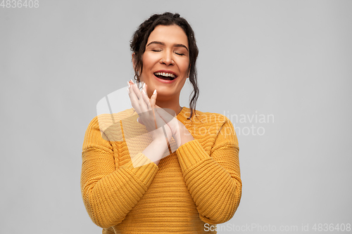 Image of happy smiling young woman with pierced nose