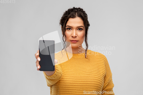 Image of woman showing smartphone