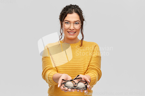 Image of happy smiling young woman with glasses