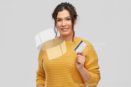 Image of happy smiling young woman with credit card