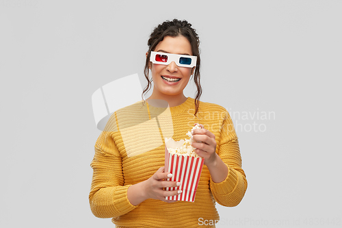 Image of happy woman in 3d movie glasses with popcorn