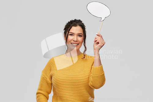 Image of smiling young woman holding speech bubble