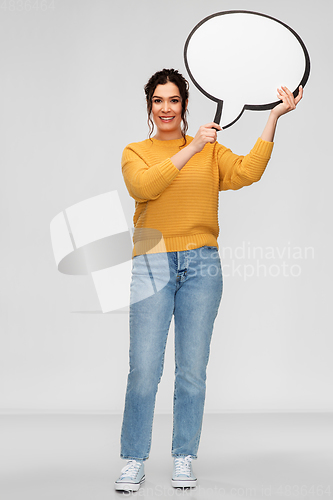 Image of smiling young woman holding big speech bubble