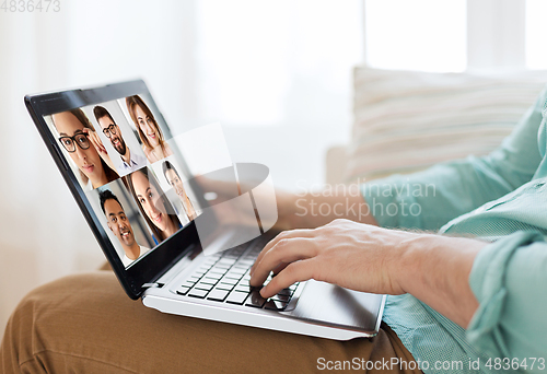 Image of man with laptop having video call with colleagues