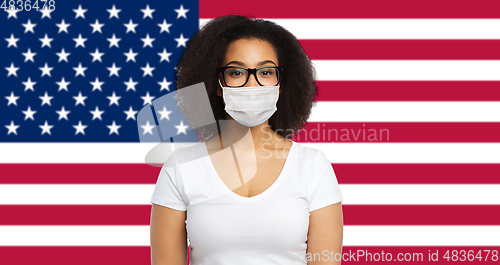 Image of african american woman in protective medical mask