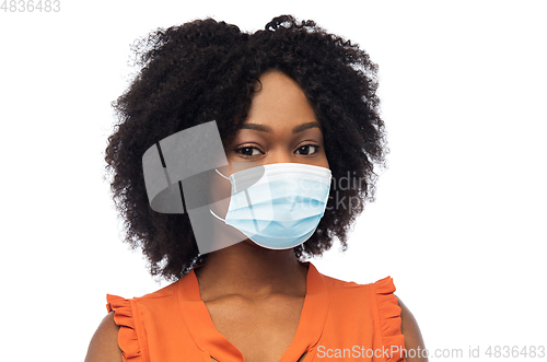 Image of african american woman in protective medical mask