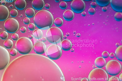 Image of Purple defocused abstract background picture made with oil, water and soap