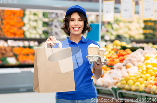 Image of delivery woman with takeaway food and drinks