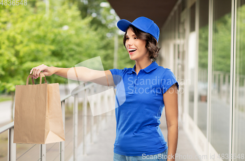 Image of delivery woman with takeaway food in paper bag