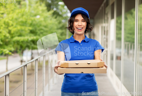 Image of delivery woman with takeaway pizza boxes