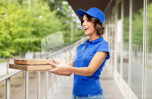 Image of delivery woman with takeaway pizza boxes