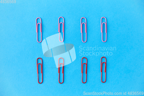 Image of office clips on blue background