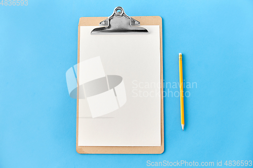 Image of clipboard with white paper sheet and pencil